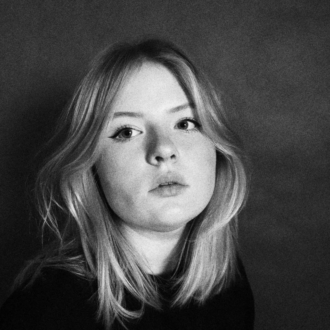 grayscale photo of girl in black shirt